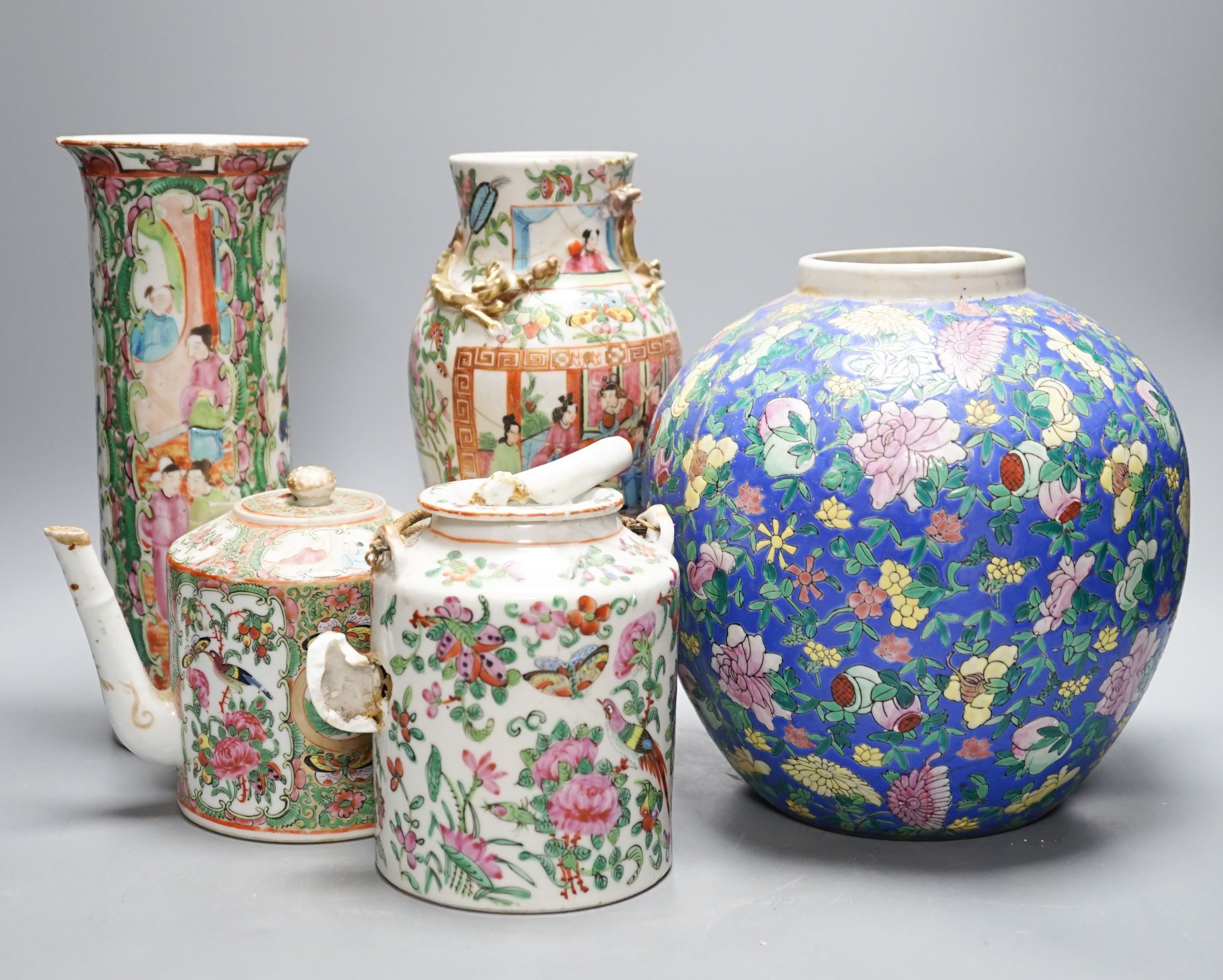Two Chinese famille rose vases, two Chinese famille rose teapots and a blue ground enamelled jar tallest 26.5cm